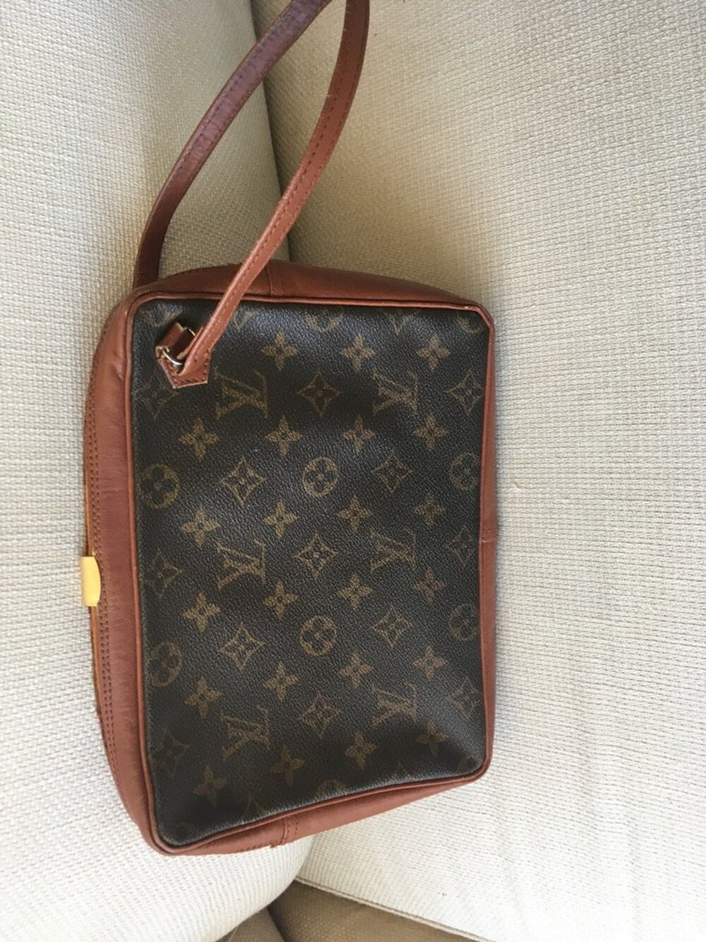 Louis Vuitton initial clutch bag - has led a hard life but still wants to dance